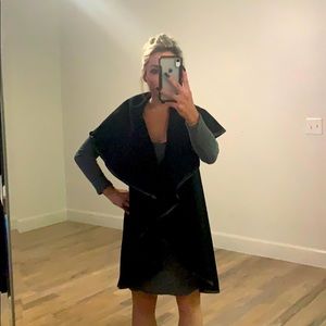 Black sleeveless jacket